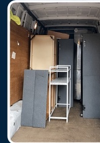 Van loaded with shelving and furniture for a house removal
